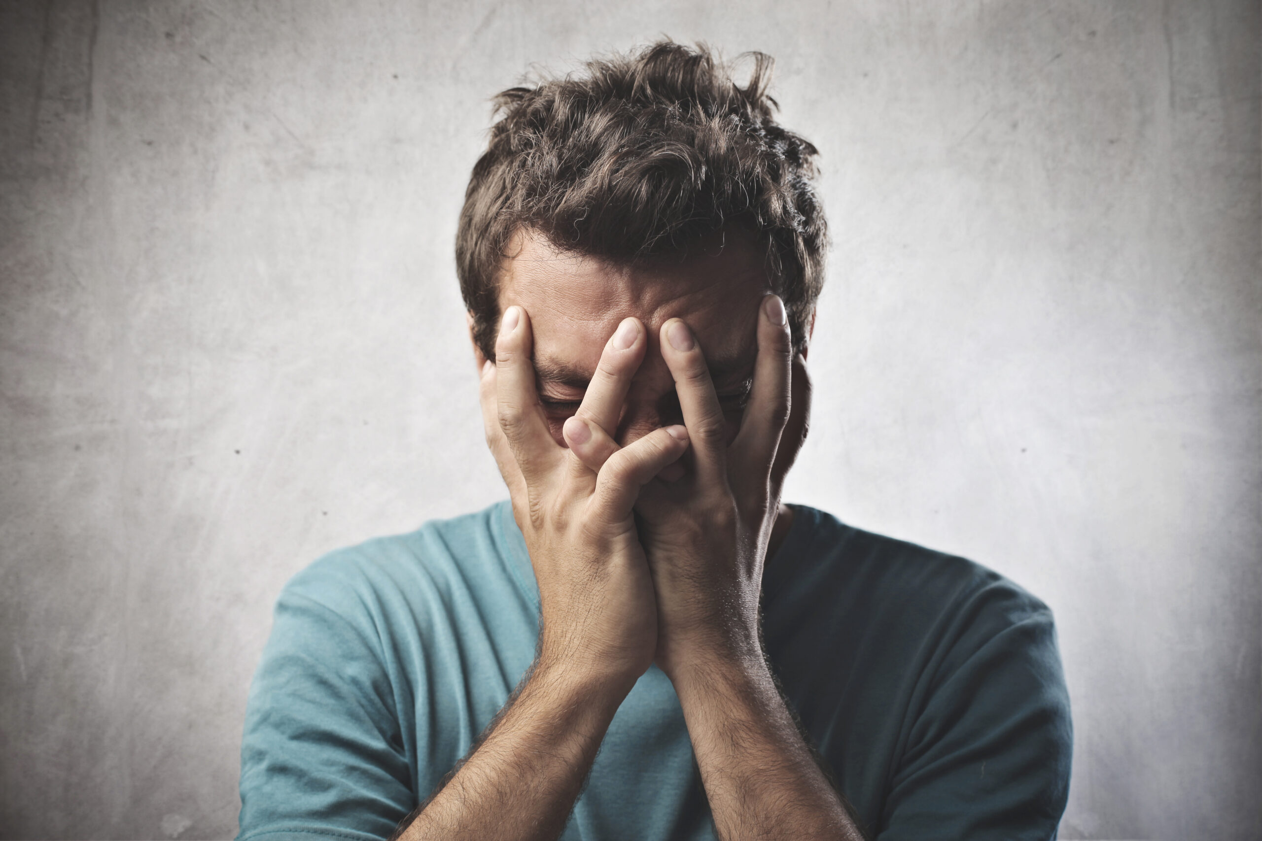 Desperate,Young,Man,Crying,In,His,Hands