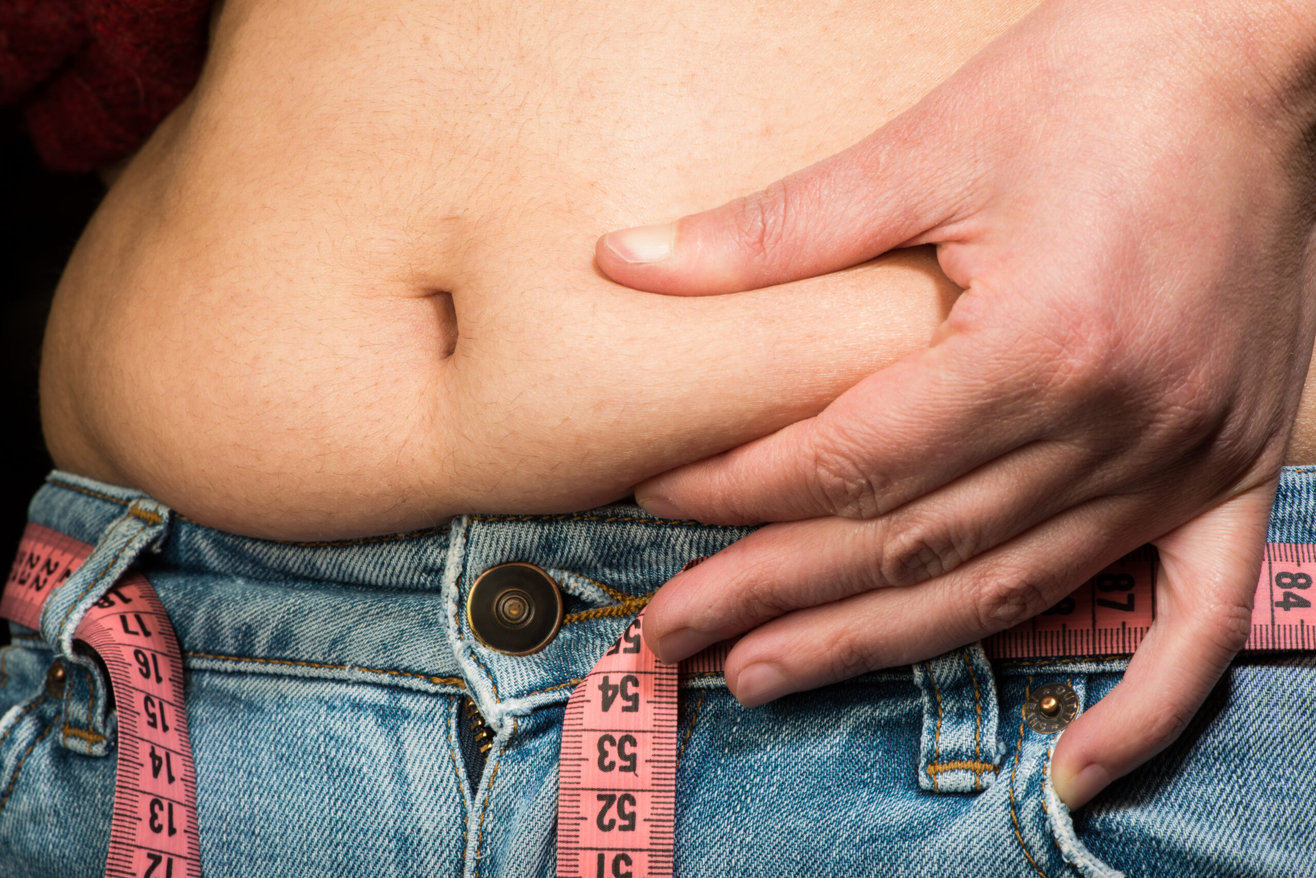 Woman,Showing,Fat,Belly.,Pink,Tape,Measure