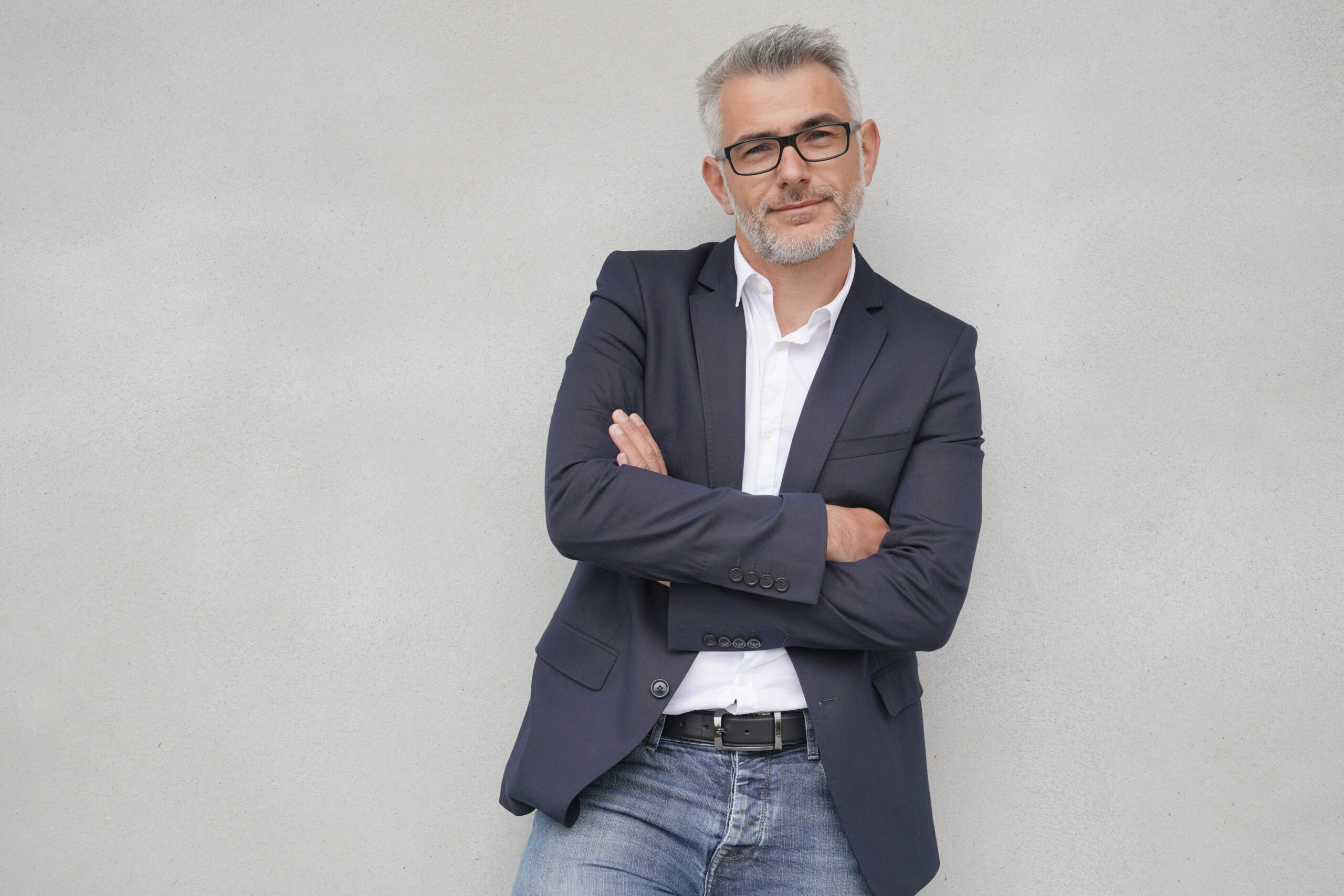Businessman,Leaning,On,Concrete,Wall,,Isolated